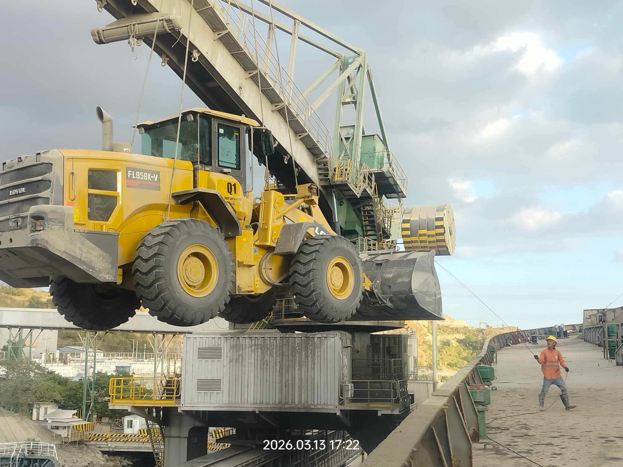 Team conducting inspection beside a wheel loader