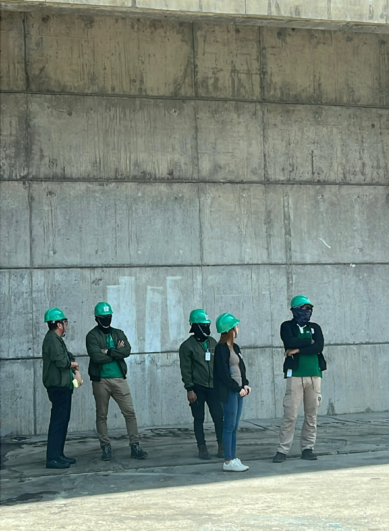 HBR personnel lined up at an industrial site in branded safety gear
